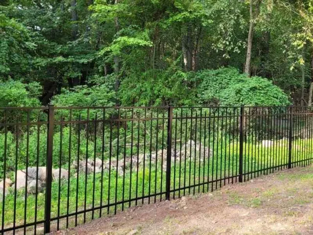Black aluminum fence install at a residential NJ property